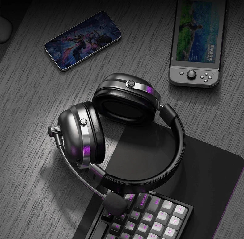Commander headset alongside a phone, handheld console and keyboard